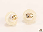 White acrylic studs with pearl and twin C motif