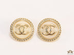 Twin C motif gold plated round studs on pearly cream acrylic base
