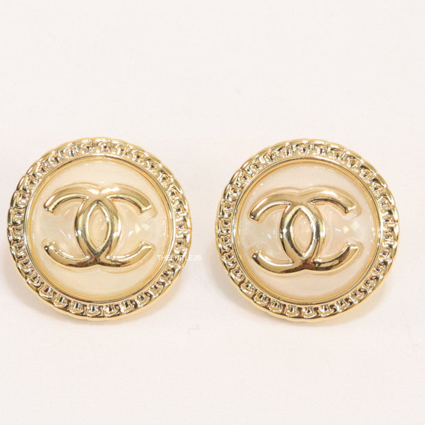 Twin C motif gold plated round studs on pearly cream acrylic base