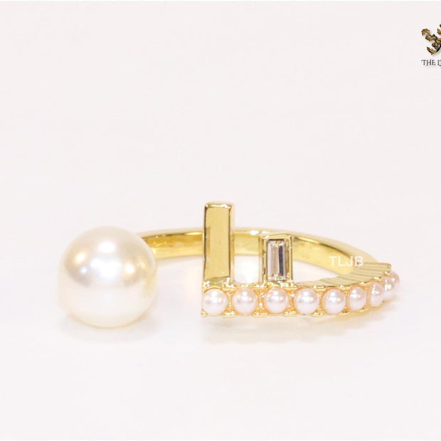 Pearl and alphabet F open ring