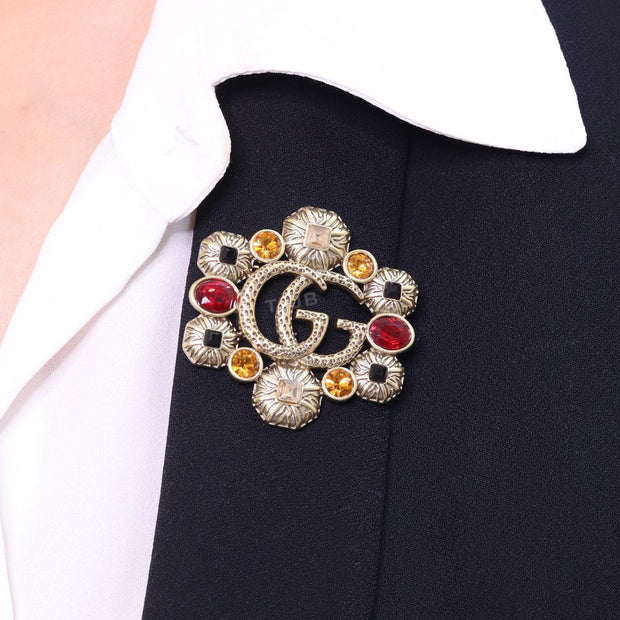 Double G embossed rustic brooch with multi coloured stones