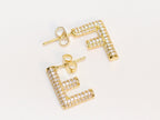 Alphabet F cz earrings in gold finish
