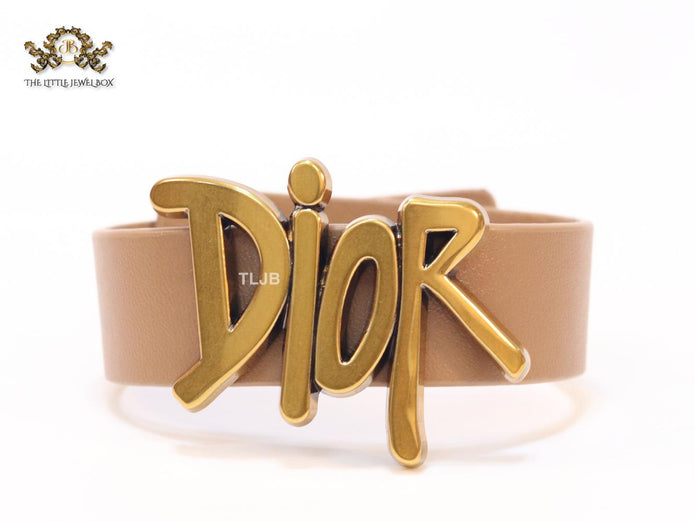 Alphabet D and tan belted bracelet