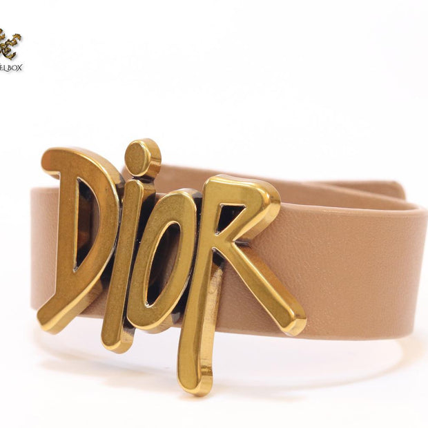 Alphabet D and tan belted bracelet
