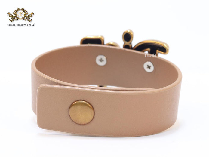 Alphabet D and tan belted bracelet