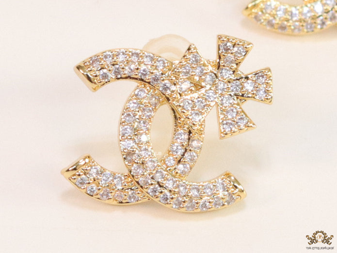 Gold plated flower and twin C motif cz studs