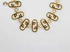 Alphabet F gold toned necklace