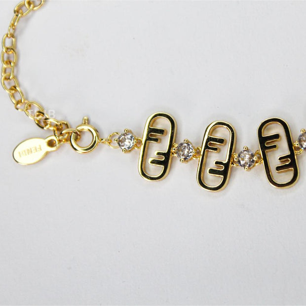 Alphabet F gold toned necklace