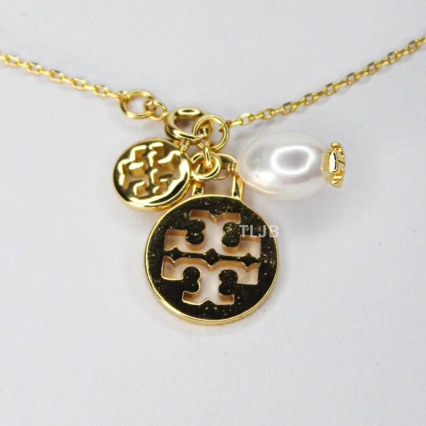 Three charm gold toned bracelet