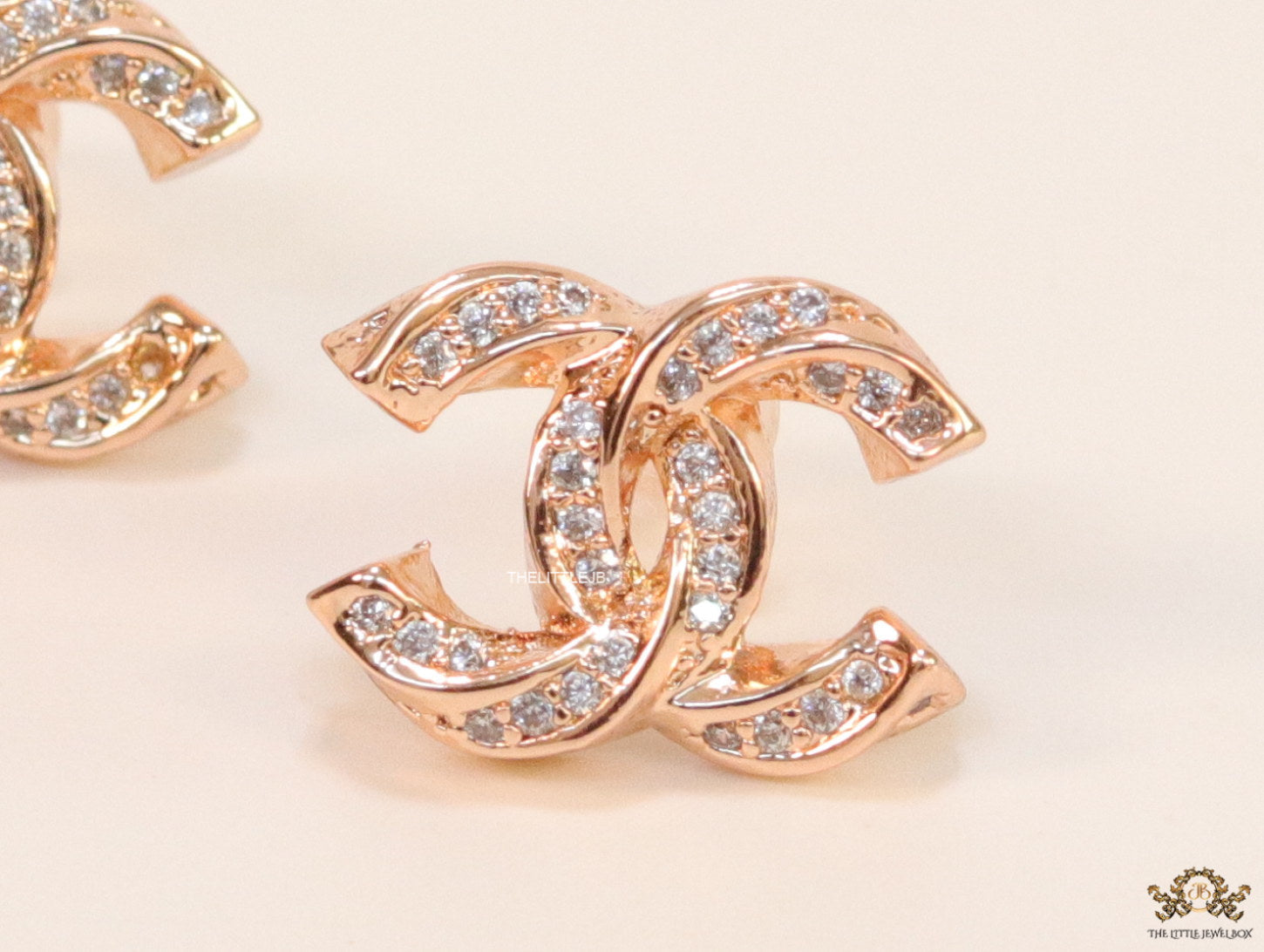 Rose gold plated entwined twin C motif cz studs