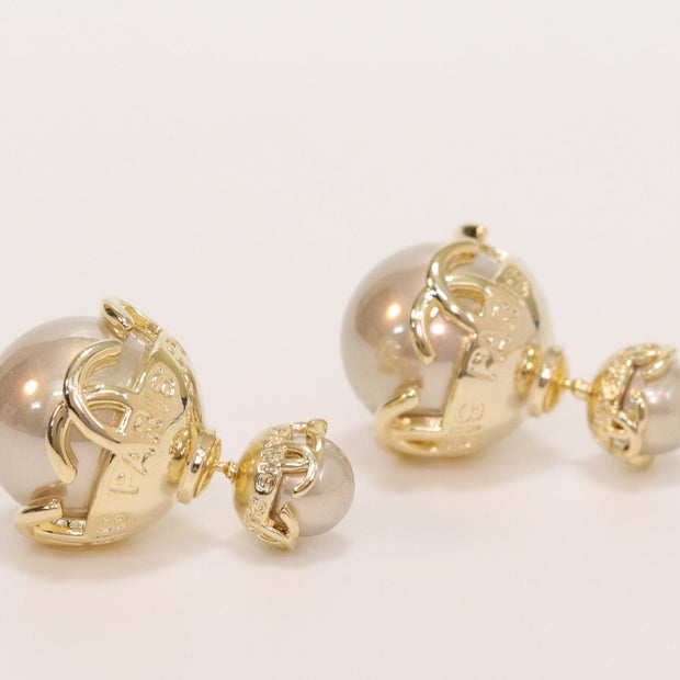 Double C beige pearl studs in gold finish
