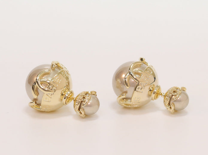 Double C beige pearl studs in gold finish
