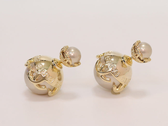 Double C beige pearl studs in gold finish