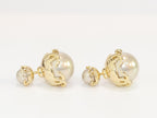 Double C beige pearl studs in gold finish