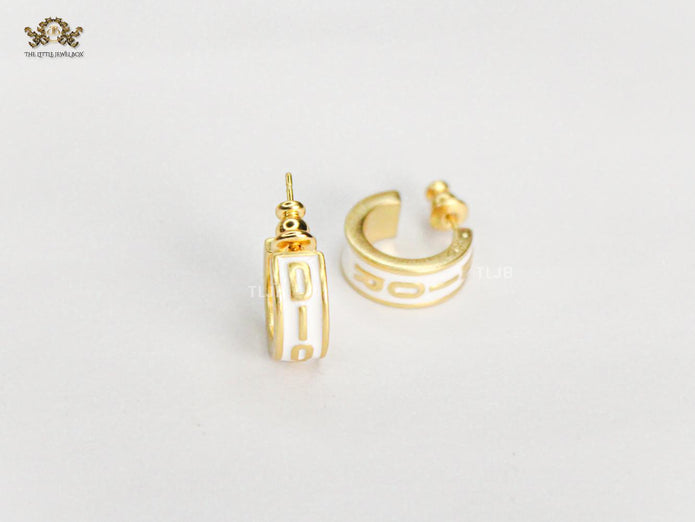 Alphabet D white hoops with gold detailing