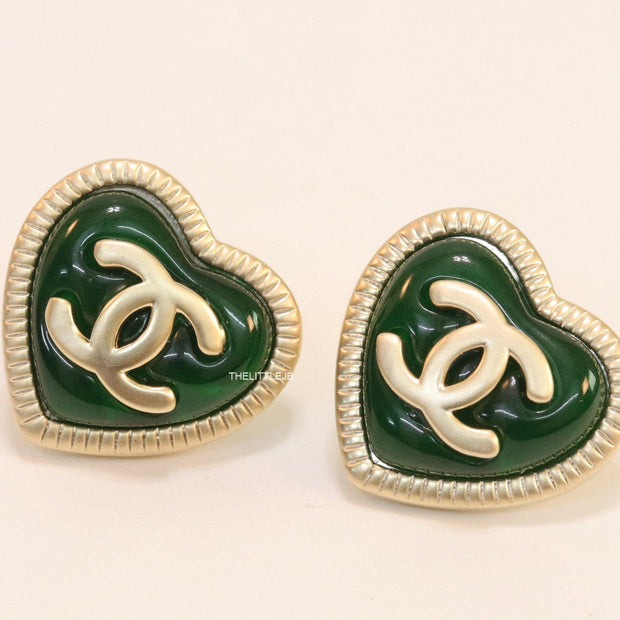 Heart shape twin C motif golden studs with deep green base