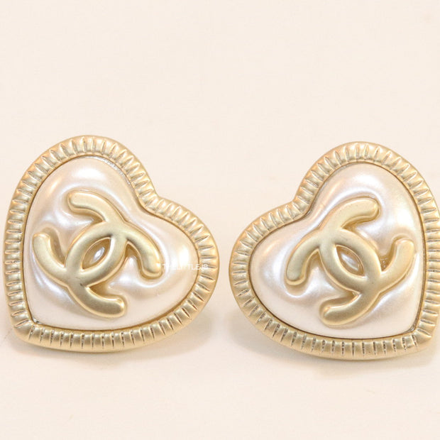 Heart shape twin C motif golden studs with pearl base