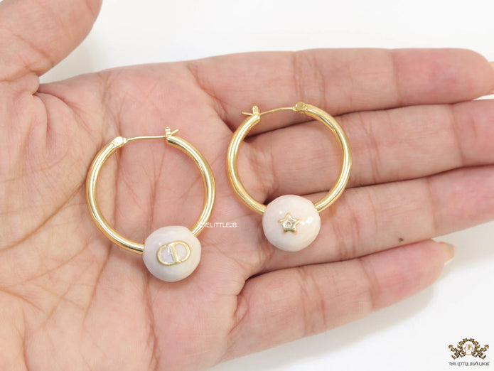 Golden hoops with pearl drops