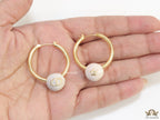 Golden hoops with pearl drops