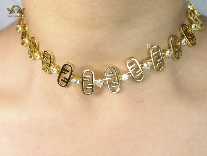 Alphabet F gold toned necklace