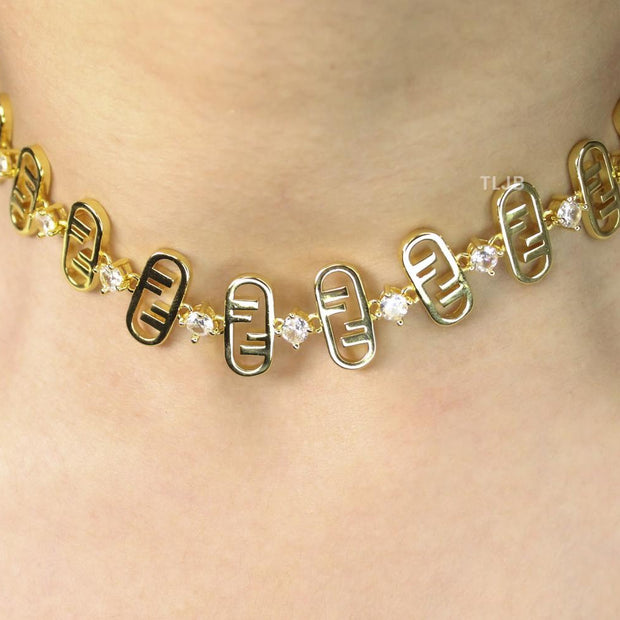 Alphabet F gold toned necklace