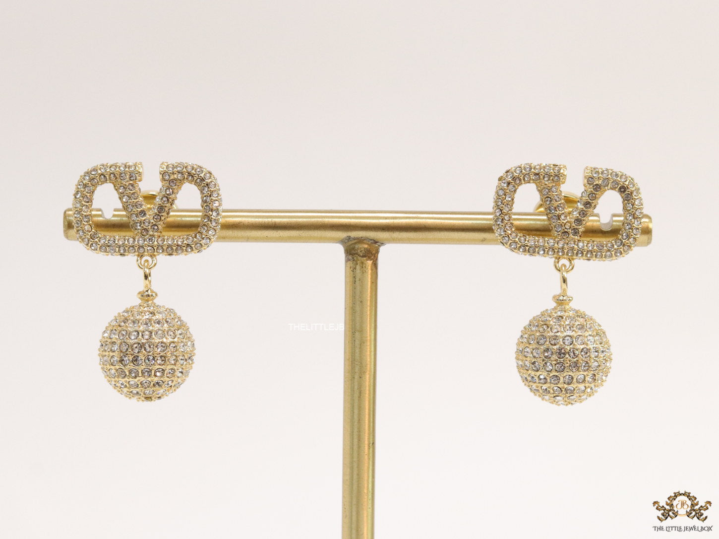 Gold plated cz alphabet v earring with cz ball drops