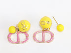 Pink and Yellow alphabet CD stud in gold finish