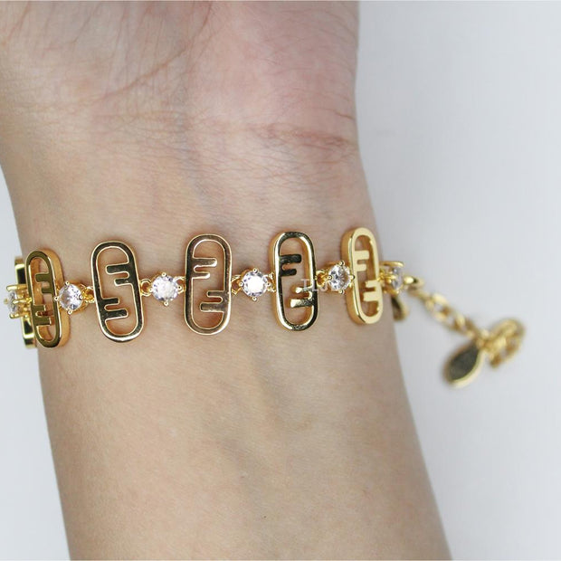 Alphabet F studded gold bracelet
