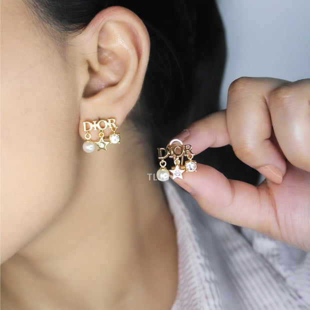 Alphabet D  mini charmed earrings in gold