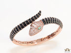 Top open serpentine bracelet in black enamel with rose gold plated details and cubic zirconia stones head
