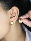 Alphabet C gold toned studs