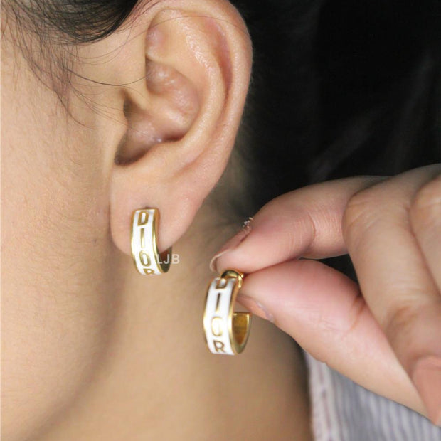 Alphabet D white hoops with gold detailing