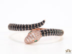 Top open serpentine bracelet in black enamel with rose gold plated details and cubic zirconia stones head