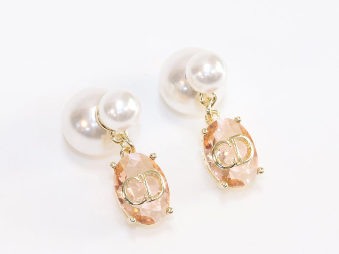 Alphabet C and D dangling baby pink stone pearl studs in rose gold finish