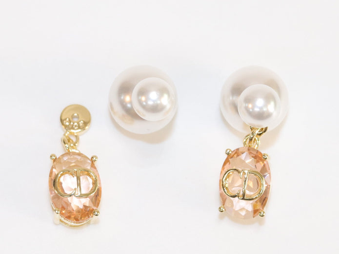 Alphabet C and D dangling baby pink stone pearl studs in rose gold finish