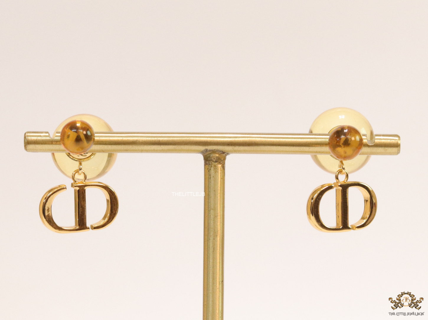 Golden pearl bomber earrings with alphabet initial drops