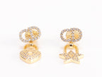 Alphabet C and D lock and star dangling stud in gold finish with cz