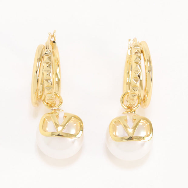 Alphabet V pearl dangling studs in gold finish