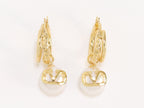 Alphabet V pearl dangling studs in gold finish