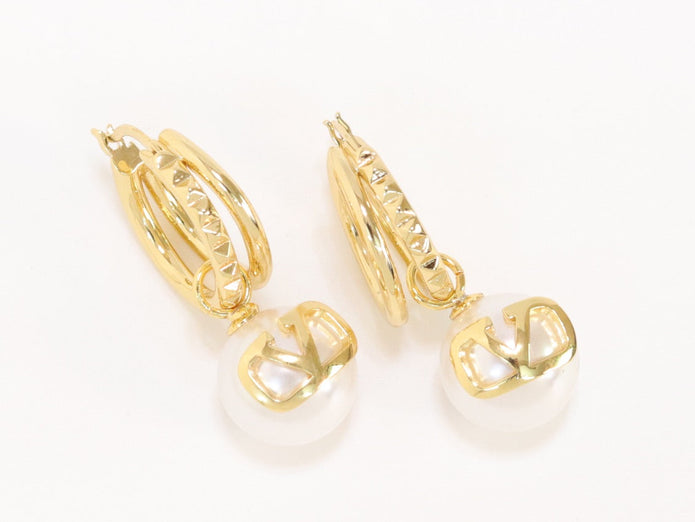 Alphabet V pearl dangling studs in gold finish