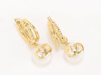 Alphabet V pearl dangling studs in gold finish