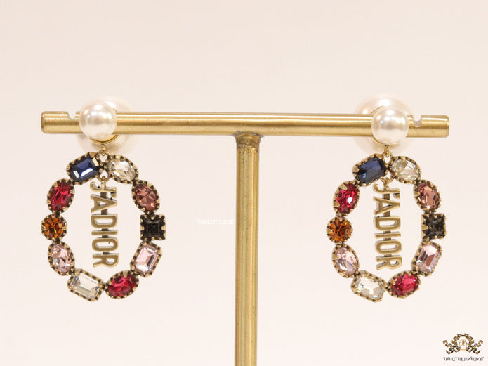 Gold plated pearl bomber earrings with multi cz motif and designer initials