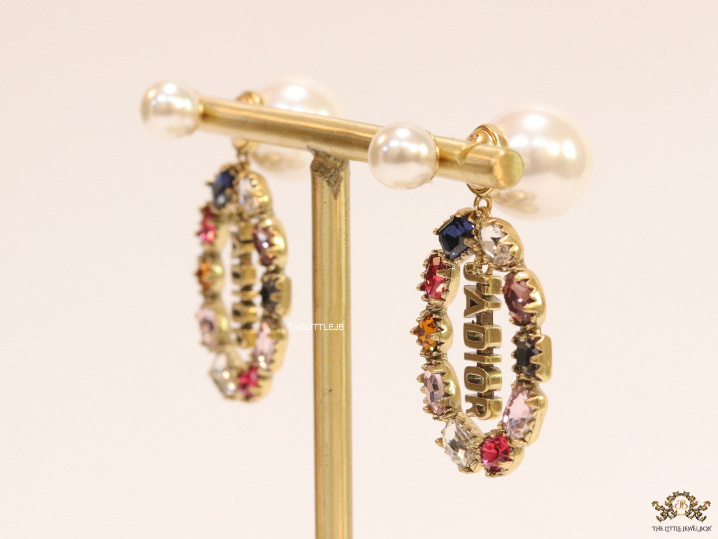 Gold plated pearl bomber earrings with multi cz motif and designer initials