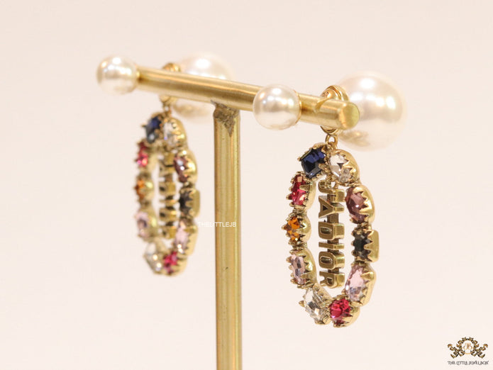 Gold plated pearl bomber earrings with multi cz motif and designer initials