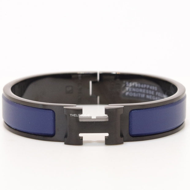 Premium collection band style bracelet in matt blue with black metallic details and black T alphabet motif