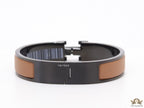 Premium collection band style bracelet in matt tan with black metallic details and black T alphabet motif