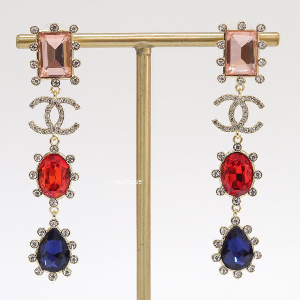 Gold plated cz dangles with red and blue stones and fancy cut cz