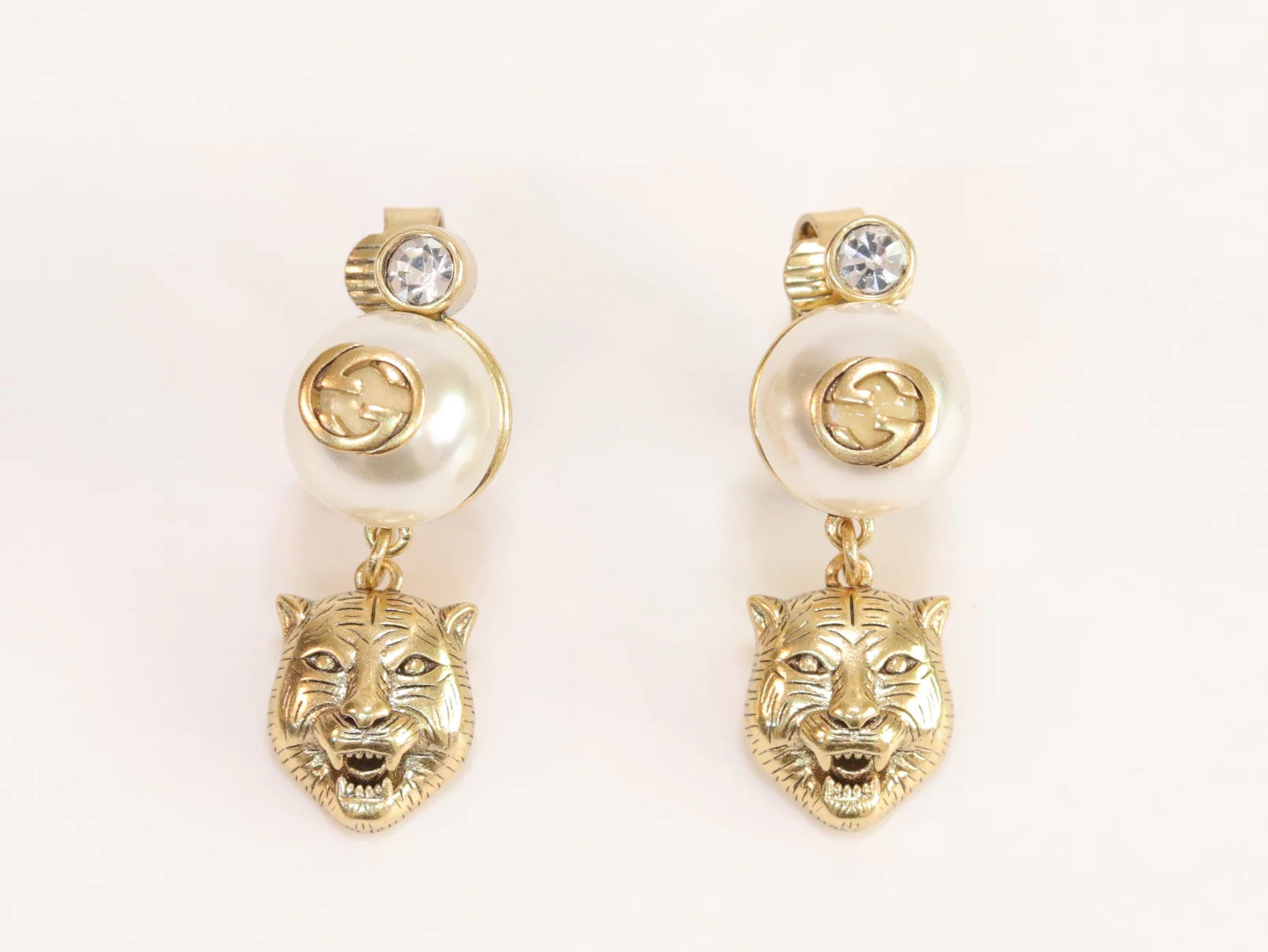 Double G panther pearl dangles in gold finish with CZ