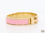 Premium range band style bracelet in pink colour with gold plated metallic details and gold plated T alphabet motif