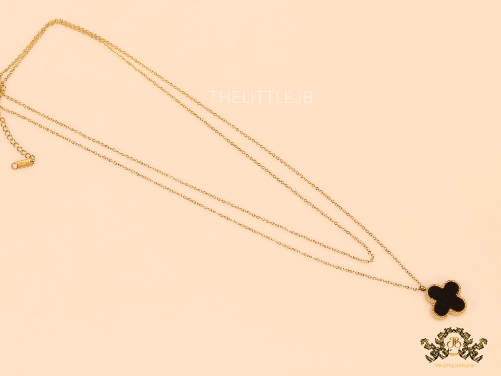 Gold plated chain with black onyx clover pendant